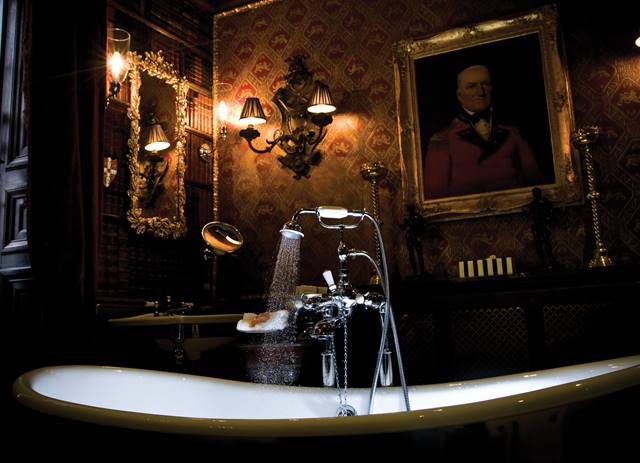 Free standing bath with extravagant gothic decor in the Old Rectory hotel suite's secret bathroom